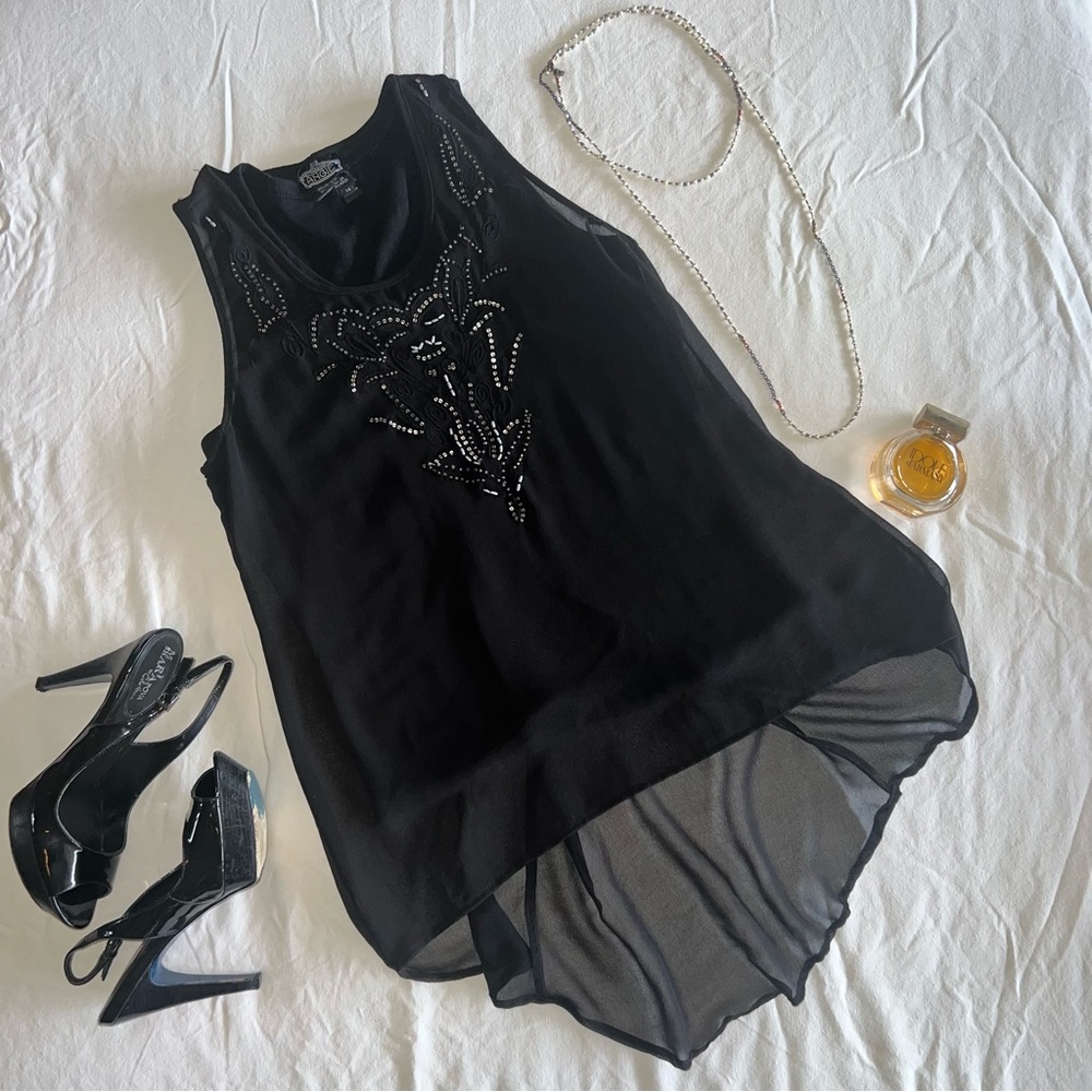 Angie Sheer sleeveless blouse with high low hem and Beaded front.
